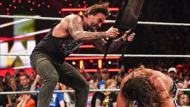WWE RAW intense match action with CM Punk and Seth Rollins