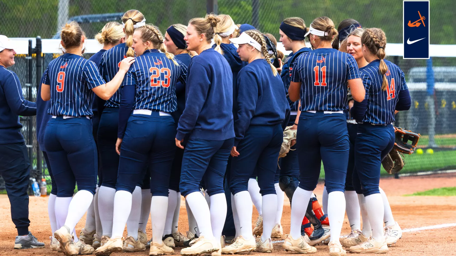 Players competing in a 2025 college softball match, representing TBD excitement and energy