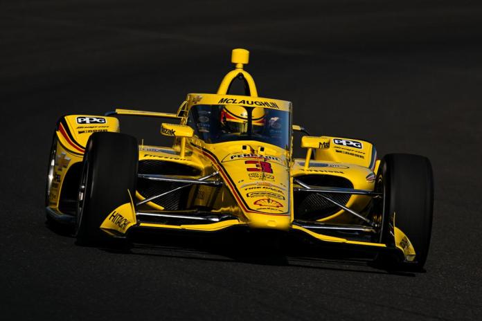 Indy 500 car zooming around the track on Fast Friday
