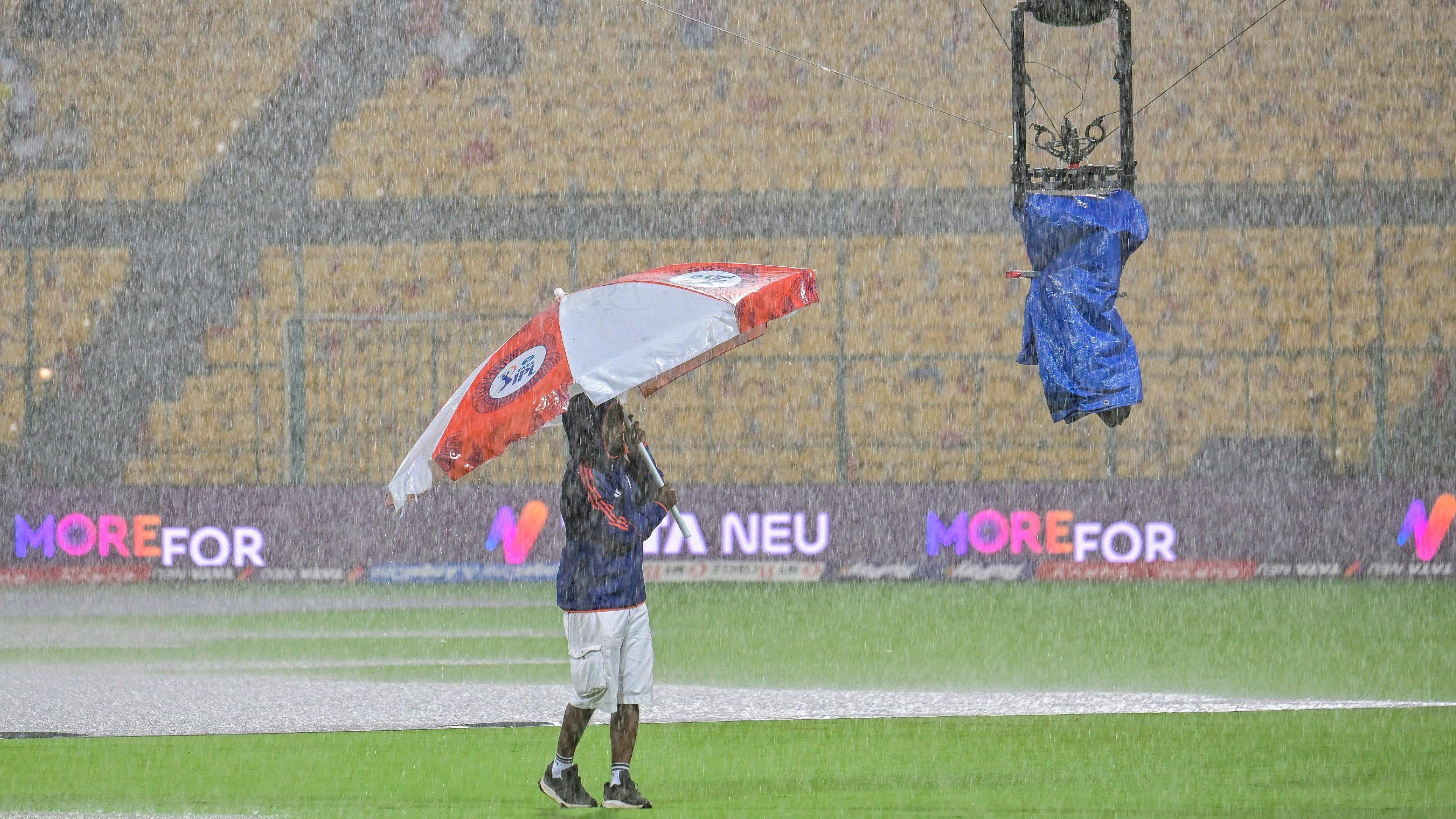 A packed stadium during a Royal Challengers Bengaluru vs Kolkata Knight Riders IPL match, with fans eagerly awaiting the toss.