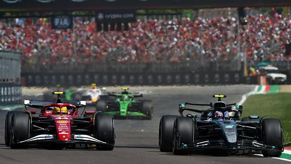 McLaren and Red Bull cars battle for positions, f1 standings in balance